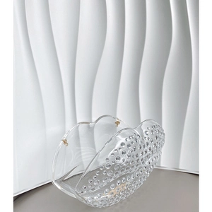 Detailed view of the sparkling crystal lip clutch with transparent finish and metal clasp