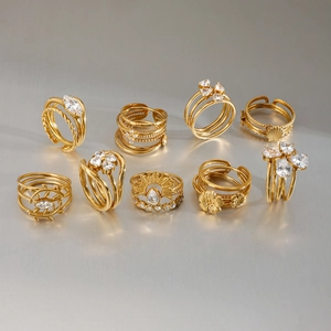 9-piece set of gold geometric rings with shell, sunflower, and zirconia details