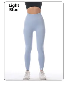 Detail of light blue high-waisted yoga pants with seamless ribbed waistband design