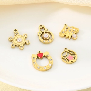 Close-up of five gold stainless steel pendants with pearls, rhinestones and enamel details