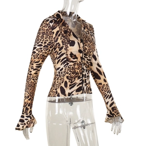 Detail view of v-neck leopard print slim top with ruffled sleeve cuffs on a mannequin