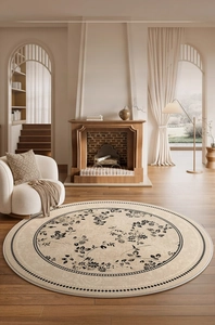 Detail of round cream carpet with black floral patterns in French vintage living room