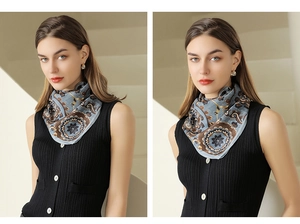 Detailed close-up of retro paisley silk scarf with elegant blue and gold floral patterns