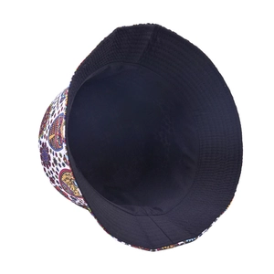 Detail of reversible bucket hat with colorful vintage mandala print and black lining