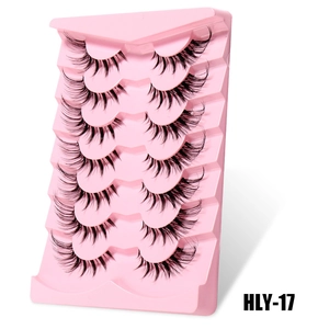 Detail view of 7 pairs of fox-eye false eyelashes with clear bands and elongated ends