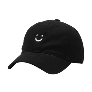 Classic black cotton baseball cap featuring a white smiley face embroidery on the front