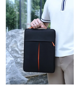 Close-up of portable 14-inch laptop sleeve with black waterproof fabric and orange accents