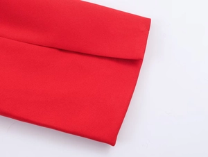 Detailed macro view of the minimalist red woven fabric cuff and clean stitching detail