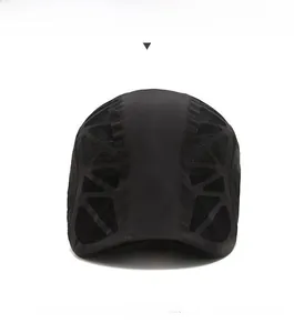 Front view of black quick-dry flat cap showing breathable mesh side panels and peak