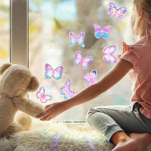 Vibrant holographic butterfly window decals creating rainbow light in a cozy home setting