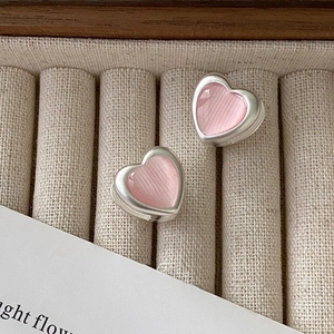 Elegant heart earrings with pink cat-eye stone inlay and silver metallic matte finish