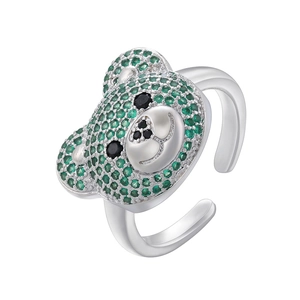 Detail of bear ring showing green pave zircons and black gemstone accents