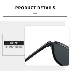 Detail shot of the sturdy metal hinge and specifications on black aviator sunglasses