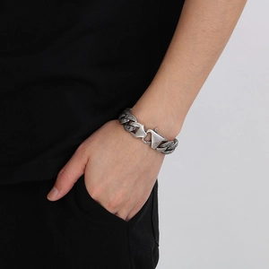Retro stainless steel chain bracelet with antique finish on model's wrist