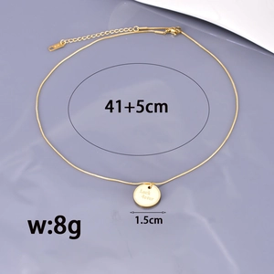 Gold stainless steel necklace with Luck 4ever pendant on light purple background