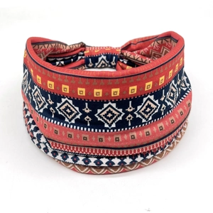 Detail of bohemian fabric headband with geometric tribal print and elastic bow knot