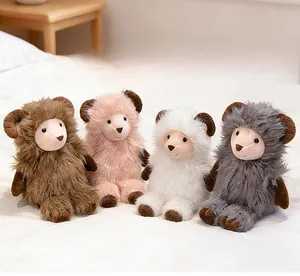 Close-up of four fluffy plush sheep dolls in white, pink, brown and grey colors