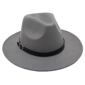 Close-up of a gray wool fedora hat with a black leather belt buckle and silver pin