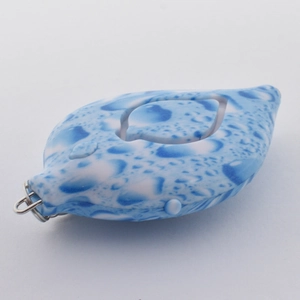 Detailed view of leaf-shaped alarm with blue water drop pattern and metal ring