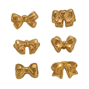 Detailed view of six gold bow charms with various textures for DIY jewelry making