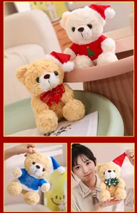 Detail of Christmas teddy bears in Santa hats and blue sweaters with snowflake patterns