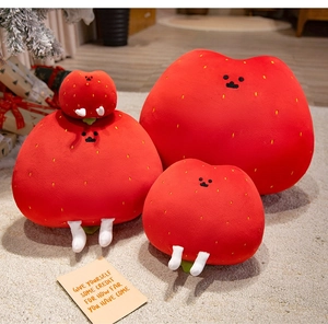 Three sizes of plush strawberry potato cake dolls on beige carpet with festive decor