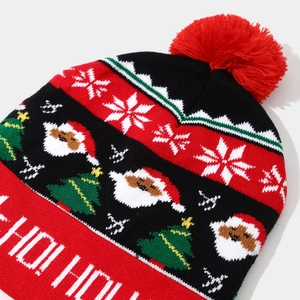 Christmas knit hat with Santa and snowman patterns featuring a red pom pom and HO HO text