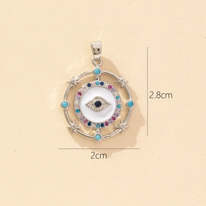 Detail of silver evil eye pendant with colorful zircons and size dimensions 2.8cm by 2cm