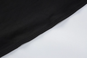 Close-up of black fabric texture and high-quality stitching on the slimming long dress
