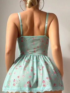 Detail of mint green floral lace lingerie set with open back and adjustable straps