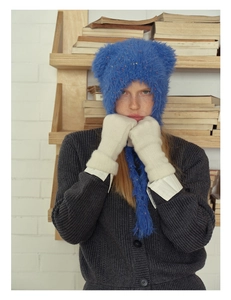 Detail of off-white 35% wool blend knit gloves with touchscreen feature for winter