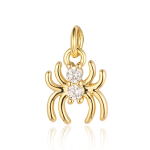 Detailed close-up of golden spider pendant with sparkling zircon stones for jewelry DIY