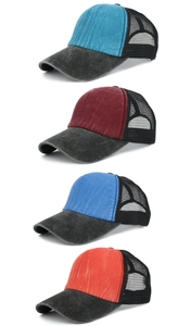 Vertical row of washed cotton trucker hats in lake blue, wine red, and royal blue