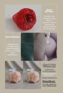 Detalle de velas artesanales en forma de fresa y cubo con texturas y poros naturales