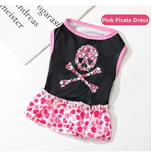 Detail of pink skull print pet dress with heart pattern and cute floral accents