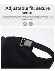 Close-up of adjustable silver metal buckle and durable canvas texture on black baseball cap