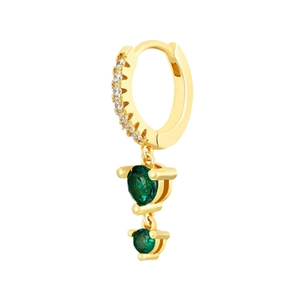 Detail of golden huggie earrings featuring white pave stones and green round gems