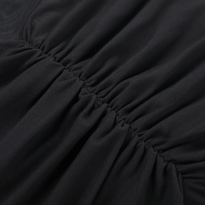 Detailed macro view of black ruched mesh fabric texture and pleated craftsmanship