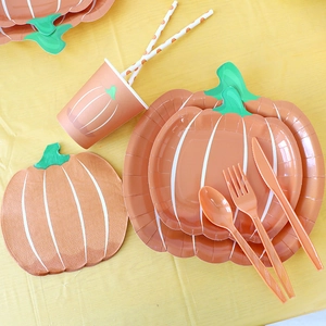 Thanksgiving pumpkin paper plates and cutlery set with orange napkins and straws
