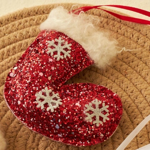 Red sequin Christmas stocking ornament with white fur trim and silver snowflake patterns