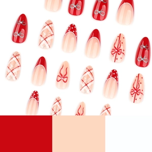 Red and white Christmas almond press-on nails with bow designs and pearl accents