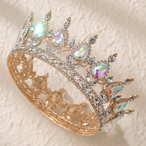 Detailed macro view of golden baroque crown featuring clear and iridescent crystals