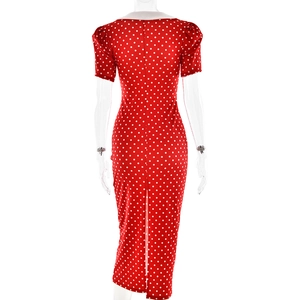 Rear view of vintage red polka dot dress with white Peter Pan collar and back slit detail