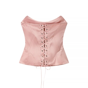 Pink satin corset crop top featuring a front lace-up design and boning structure