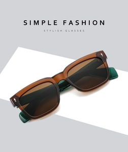 Detail view of retro square sunglasses with brown frame and green temples with silver rivets