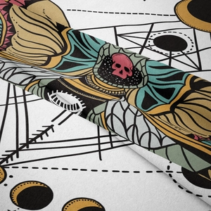 Close-up of soft flannel tapestry fabric showing detailed occult butterfly and skull prints