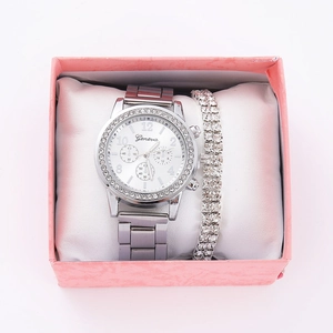 Silver Geneva watch and rhinestone bracelet set displayed in a pink jewelry gift box