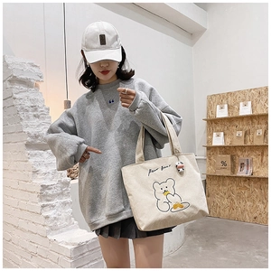 Corduroy tote bag featuring a cartoon bear embroidery and a cute cow plush pendant