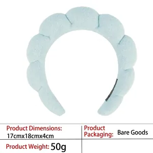 Detail showing dimensions of the light blue padded sponge headband and its soft texture