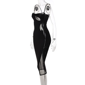Detail of black bodycon dress featuring sheer mesh panels and supportive bustier design
